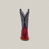 The Exotic Python - Ruby / Blue - Square Toe boot is shown front-facing, with a red textured lower and blue upper shaft featuring white stitching, against a plain beige background. From the Platinum Collection.