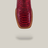 Close-up of the Exotic Python - Ruby / Blue - Square Toe boot, highlighting detailed stitching, from the Platinum Collection, displayed against a plain beige background with a subtle shadow underneath.