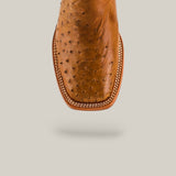 Close-up of Exotic Full Quilt Ostrich Fawn - Square Toe - Kids Boots, crafted from luxurious ostrich leather with a square toe and decorative edge stitching, set against a plain light background for classic Western style.
