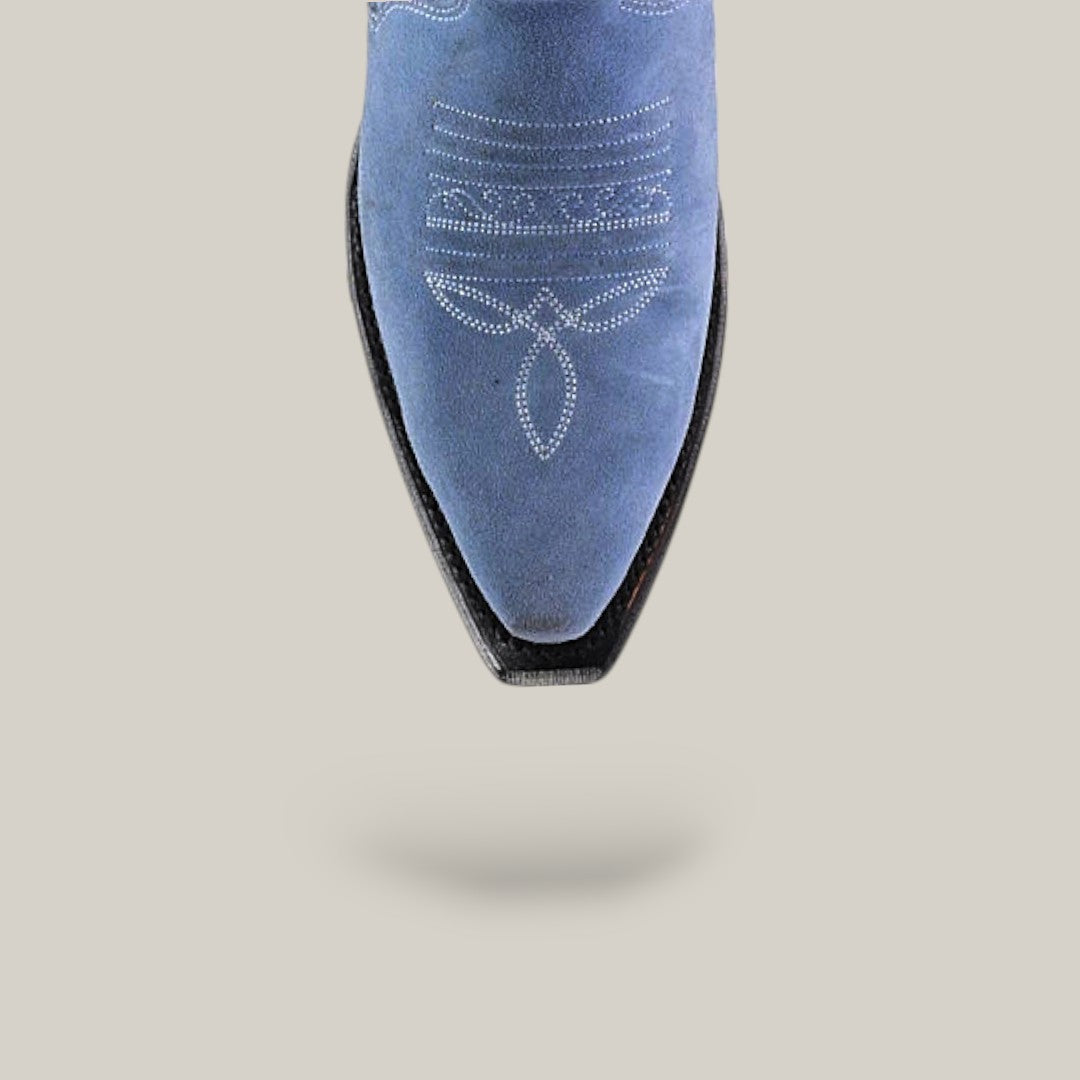 The Elizabeth Light Blue - Tall Shaft - Snip Toe boot is shown from above, showcasing blue suede with white decorative stitching, a pointed toe, and a soft shadow on a light gray background—an elegant choice for women.
