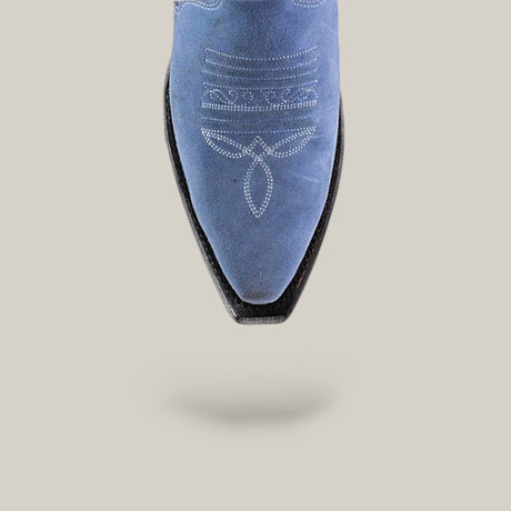 The Elizabeth Light Blue - Tall Shaft - Snip Toe boot is shown from above, showcasing blue suede with white decorative stitching, a pointed toe, and a soft shadow on a light gray background—an elegant choice for women.