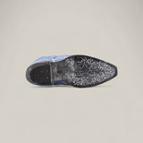 The Elizabeth Light Blue - Tall Shaft - Snip Toe women’s dress shoe is shown on its side, revealing a black sole with detailed floral and swirl engravings plus metallic accents, set against a plain, light background.
