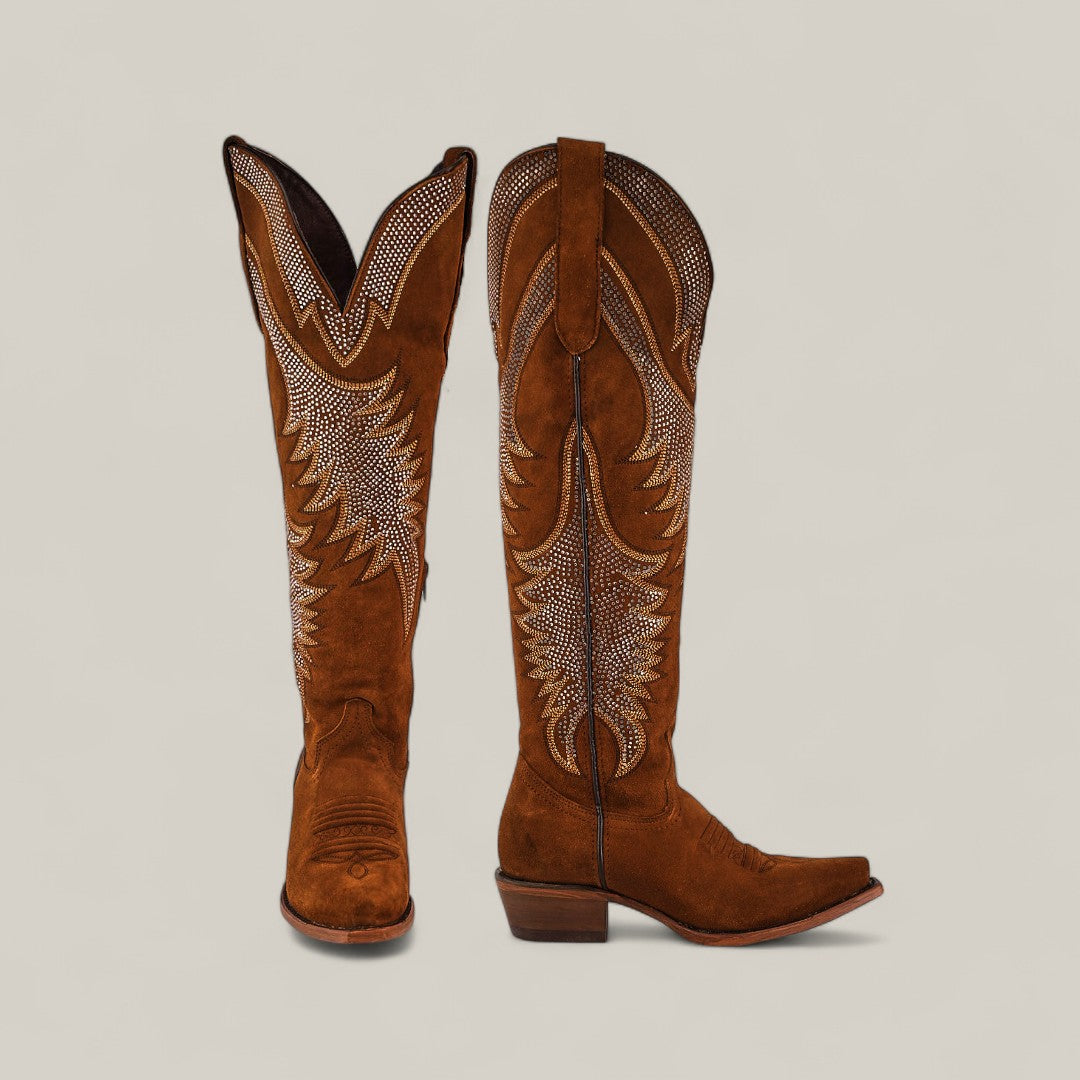 The Daisy Camel - Tall Shaft - Snip Toe boots, shown on a light background with decorative white stitching, feature one boot upright and the other angled to highlight the side design—stylish womens fashion perfect for any wardrobe.
