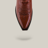 The Marjorie Star Brown - Tall Shaft - Snip Toe boot is displayed from above, highlighting its brown leather, snip toe, and decorative stitching on a light beige background with a subtle shadow.