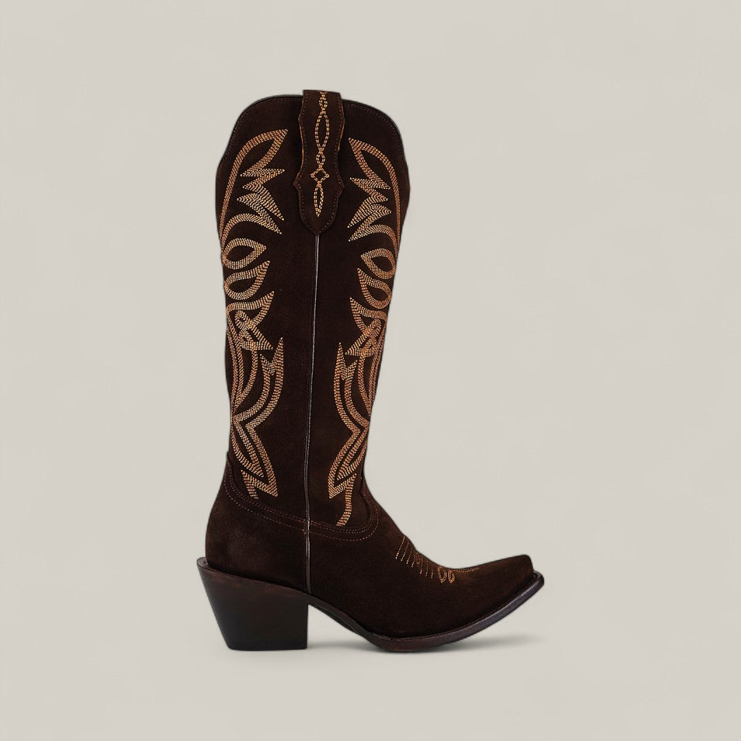 The Kellie Suede Brownie Leather Sole tall boot features a snip toe, dark brown suede, tan stitching, and a slanted heel. Shown in profile against a plain light background, its perfect for those seeking classic tall boot style.