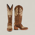 The Roxanne Crystals Tabaco tall womens boots feature brown leather, cream floral embroidery, snip toes, and stacked wooden heels. Displayed on a light beige background.