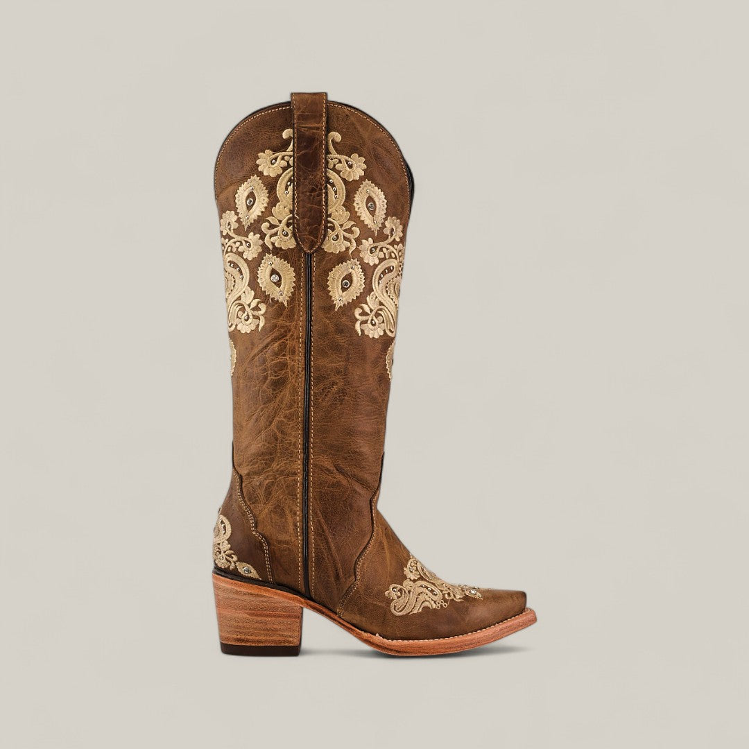 The Roxanne Crystals Tabaco features a tall shaft and snip toe, crafted from brown leather with medium heel, highlighted by cream floral and paisley embroidery for a luxurious womens cowboy boot.