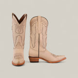 The Tessa Champagne Mid Shaft snip toe boots for women in light beige feature decorative stitching. Displayed on a plain background, one boot stands upright to show the front while the other reveals a side profile and wooden heel.