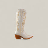 The Kellie Frost White Leather Sole boot features a tall shaft, snip toe, light tan decorative stitching, and a wooden angled heel set against a light beige background.