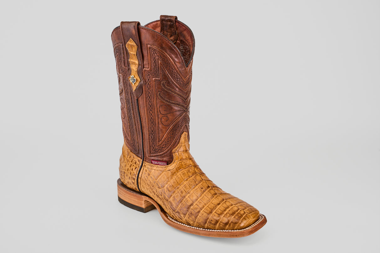 The Exotic Caiman Belly - Camel - Square Toe boot features a brown leather upper, textured tan caiman belly lower, detailed stitching, square toe, and wooden heel, shown against a plain light gray background.