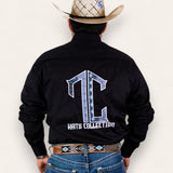 A man in a cowboy hat, black shirt with a large TC Hats Collection logo on the back, and blue jeans wears the TC Hats - Black Blue Aztec belt, featuring a stylish white and blue Aztec design, standing with his back to the camera.
