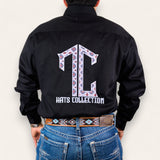 Someone wearing the TC Hats - Black Red Aztec shirt with a patterned TC logo embroidered on the back, styled with blue jeans and a matching patterned belt.