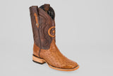 The Exotic Full Quilt Ostrich - Brandy Brucciato - Square Toe boot features a brown, lighter ostrich leather foot and a darker, decorated shaft with stitched star details, displayed against a plain gray background.