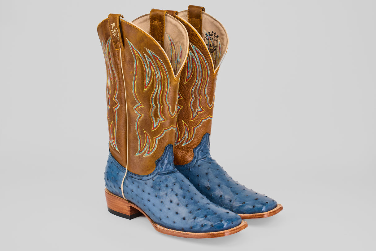 The Ridge - Blue - Square Toe boots feature blue ostrich leather feet and light brown shafts with decorative stitching, shown on a light gray background.