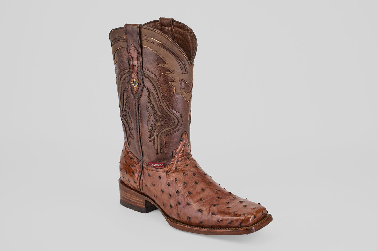 A single Austin - Brown - Rodeo Toe cowboy boot features decorative stitching and an avestruz-textured foot, displayed on a plain light gray background. Ideal for any rodeo enthusiast.