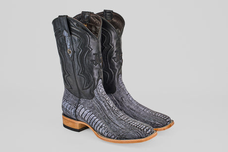 The Austin Leg - Blue Jean - Square Toe men's cowboy boots feature black ostrich leather uppers, gray textured lowers, and light brown wood heels and soles—a stylish choice that pairs perfectly with a blue jean finish.