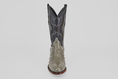The Austin - Oxford - Round Toe men's cowboy boot features a gray, textured ostrich leather lower and a dark, intricately stitched upper, shown upright on a plain white background.