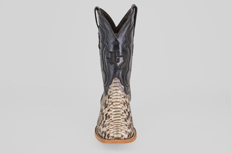 The Tanner - Natural - Square Toe cowboy boot features a textured Python Natural lower and a black leather upper with a stitched Texas outline and star, shown from the front against a plain background.