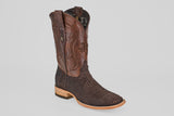 The Tanner - Matte Brown - Square Toe cowboy boot, featuring Python Cafe Nobuck with a textured lower section, decorative stitching on the shaft, and a light wooden heel, is displayed against a plain light gray background.