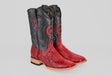 The Tanner - Ruby - Square Toe boots feature red Python Rojo snakeskin-textured lowers, black uppers with a circular star design, decorative stitching, light wooden soles, and a slight heel.