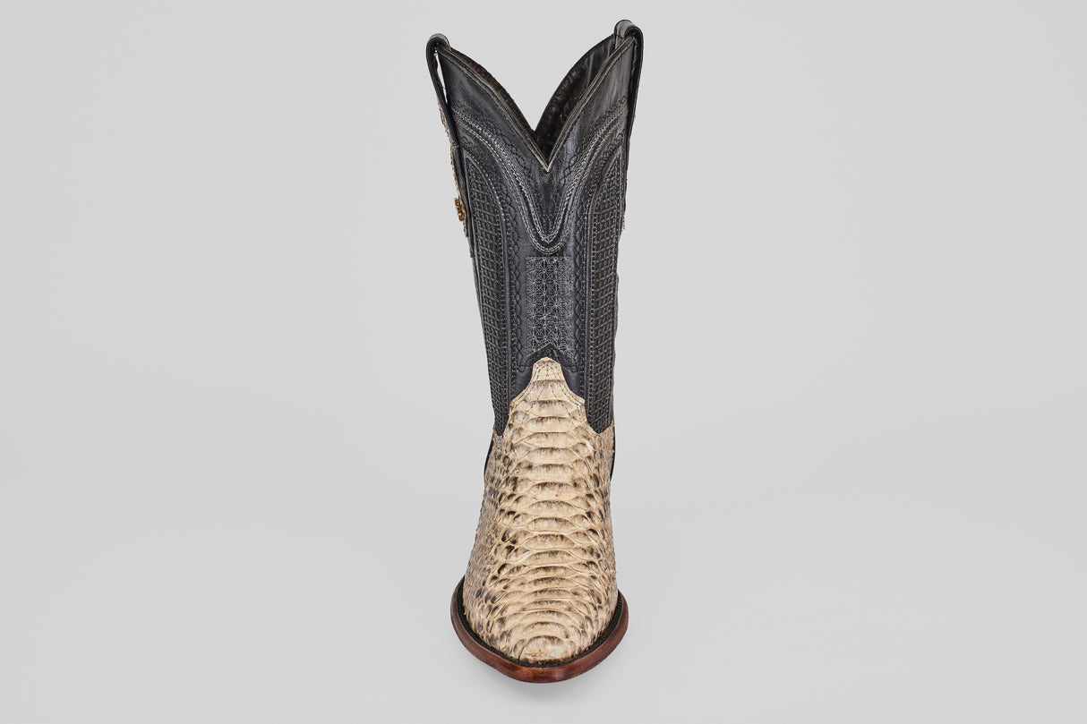 A single Tanner - Natural - Snip Toe cowboy boot, featuring a light tan Python Natural H-82 textured lower and a dark, smooth upper shaft, is displayed front-facing against a plain white background.