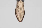 A top view of the Tanner - Natural - Snip Toe boot in beige python snakeskin leather with a brown sole, shown against a plain light grey background.