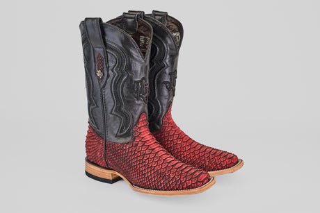 The Tanner – Scarlet – Square Toe boots feature black leather uppers, vibrant red textured scales on the lower portion, a light brown sole, decorative stitching, and a stylish modern square toe design.