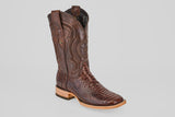 The Tanner - Brown - Square Toe cowboy boot features a textured snakeskin foot, decorative shaft stitching, star emblem, and light wooden heel, shown in a photo against a plain light gray background.