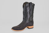A single Tanner - Matte Black - Square Toe cowboy boot with scaly black python texture and decorative stitched leather shaft. It has a light tan wooden heel and sole, shown against a plain light background. Model: PN30.