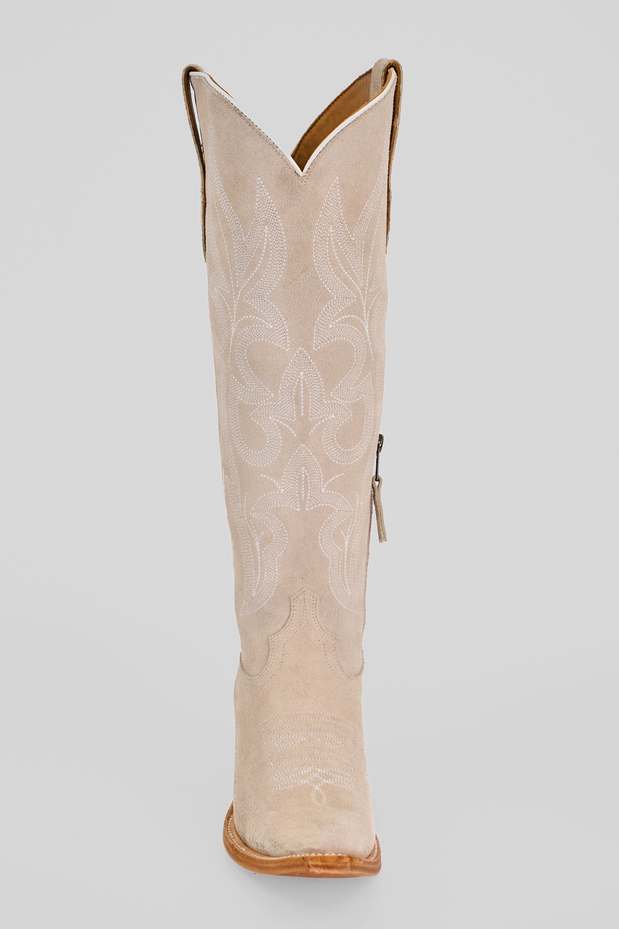 The Allison Ivory - Tall Shaft - Snip Toe boot features a pointed snip toe, decorative white stitching, and a wooden sole—shown from the front against a plain background—a stylish pick for women's western boot lovers.