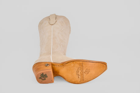 The Allison Ivory - Tall Shaft - Snip Toe boot is shown on its side, featuring a leather sole with logo stamps, snip toe, and detailed stitching along the tall shaft.