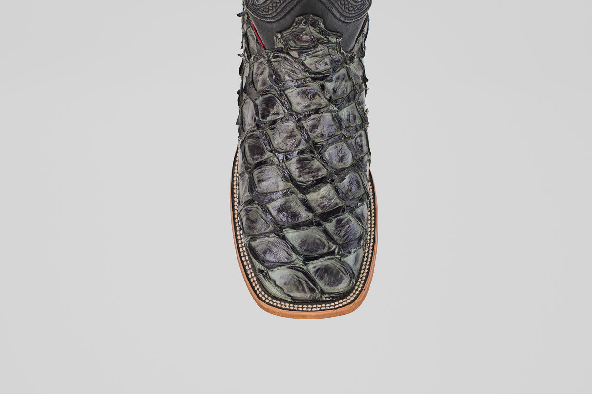 The Conor - Charcoal - Square Toe is a black cowboy boot with a square toe and brown sole, ideal for men seeking stylish western footwear.