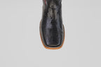 A close-up, top view of the Blaze – Black – Square Toe boots highlights their textured genuine black lizard leather with brown trim, set against a plain light gray background.