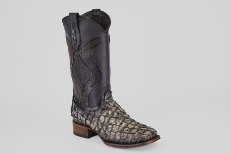 A close-up of the Conor Platinum - Newspaper - Square Toe (Diamond) men's western boots showcases their intricate stitching and rugged square-toe design.