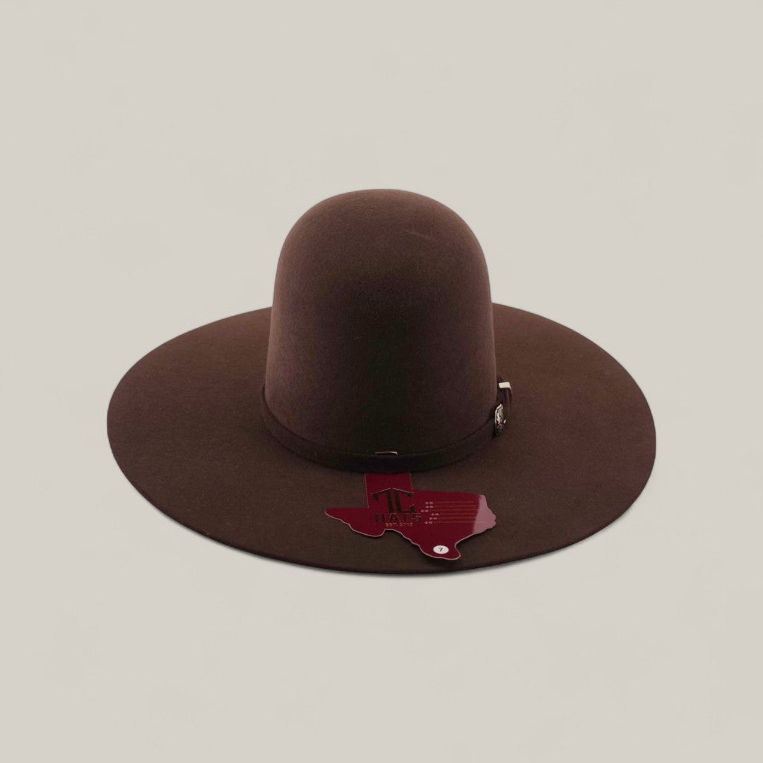 The 4X - Chocolate - TC Hats is a wide-brimmed, dark brown felt Western hat in Texana style, shown against a plain light background with a Texas-shaped tag hanging from its decorative band.