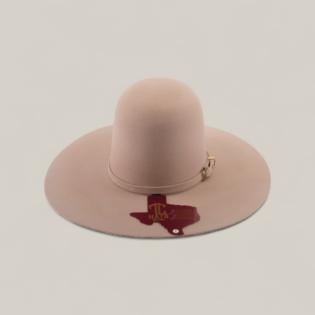 The 4X - Belly - TC Hats is a beige Western hat with a wide brim, shapeable crown, decorative band, and a dark red Texas outline with HALF 3 text and a star on the brim.