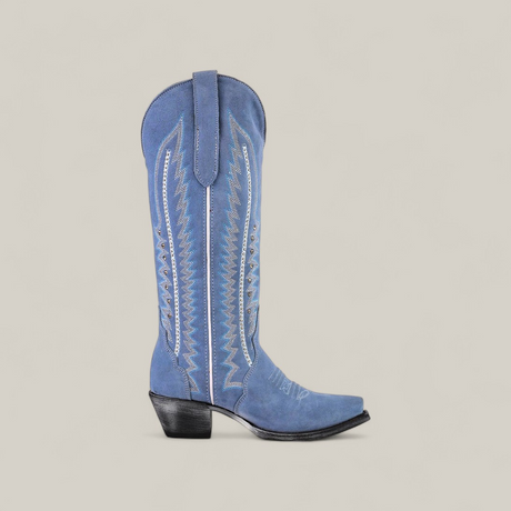 The Elizabeth Light Blue - Tall Shaft - Snip Toe womens cowboy boot, featuring decorative white stitching, a snip toe, angled heel, and pull strap, is shown against a plain beige background.