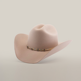 The 6X Country Belly is a beige cowboy hat crafted from premium sheep wool, featuring a wide brim and a decorative band with star-shaped metal embellishments, set against a plain white background.