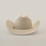 The 5X Dorado Belly, a beige western headpiece crafted from luxurious fur felt, features a wide brim and subtle top crease, evoking the classic style of Larry Mahan 5X against a plain white background.