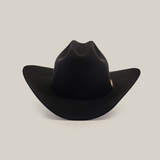 The 500X Superior Black is a classic black cowboy hat, featuring a wide brim and high crown, epitomizing premium Western headwear against a white background.