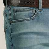 Close-up of an individual wearing Wrangler 20X Mens Light Wash Shade Bootcut Stretch Jeans - 112335407 with decorative back pocket stitching, paired with a black braided leather belt and a plaid shirt.