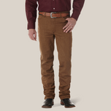 A person wearing a burgundy shirt and brown pants accessorized with a brown belt and dark brown shoes stands against a neutral background. The outfit highlights Wrangler Cowboy Cut Slim Fit Jean - 100936BKW for a relaxed fit, exuding effortless style and casual elegance.