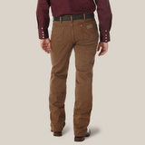 A person in a maroon long-sleeve shirt and brown Wrangler Cowboy Cut Slim Fit Jean - 100936BKW stands with their back to the camera, hands at their sides. The pants have pockets, and the shirts buttoned cuffs perfectly complement the brown shoes.